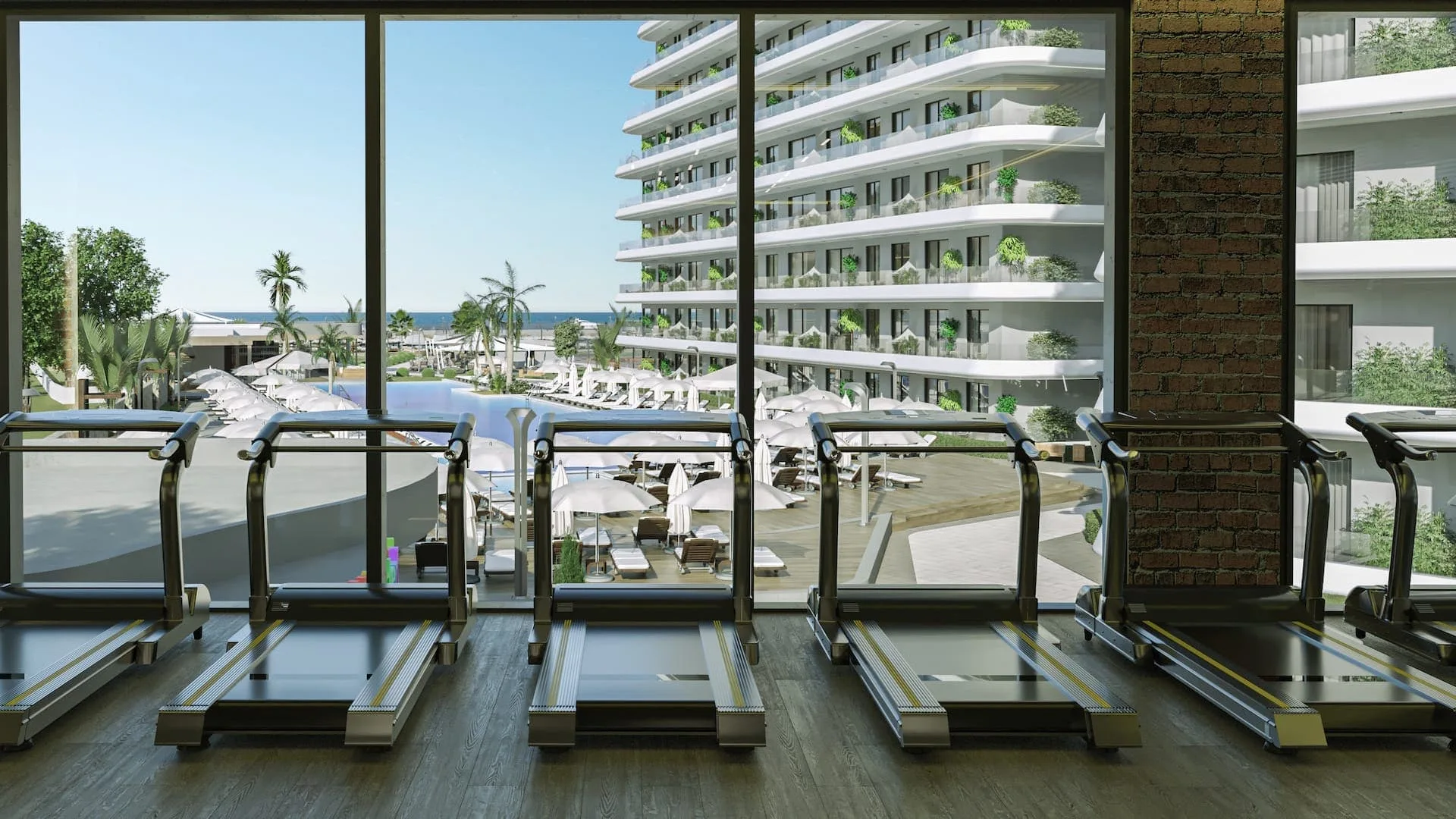 Alpcans A row of treadmills in a gym overlooking a resort with a pool, lounge chairs, and a view of a multi-story building and the ocean.