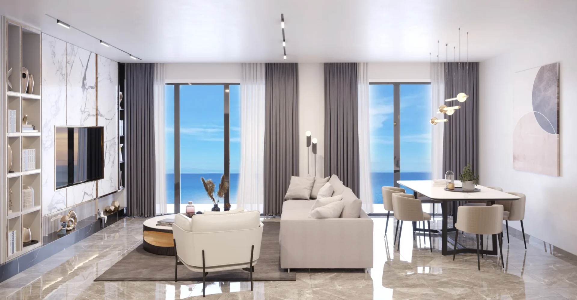 Alpcans Modern living and dining area with floor-to-ceiling windows offering an ocean view. The space features a comfortable sofa, armchair, dining table, contemporary decor, and a wall-mounted TV.